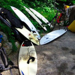 Surfboards on a river bank